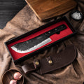 Behold the Nikushoku Butcher Knife by Seido Knives, protected in a leather case and presented in a stylish box.