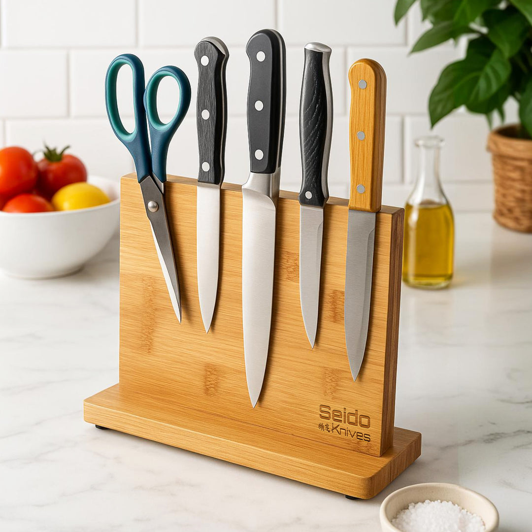 A magnetic knife block from Seido Knives, featuring four knives and scissors neatly arranged.