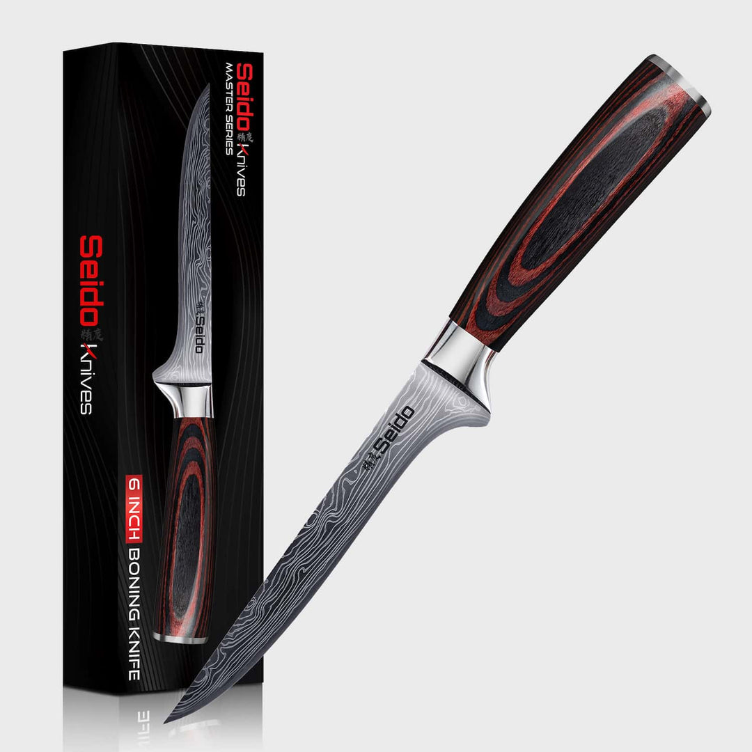 Seido boning knife with red and black handle and packaging on a white background