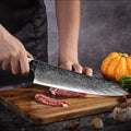 chef cutting meat with gyuto knife