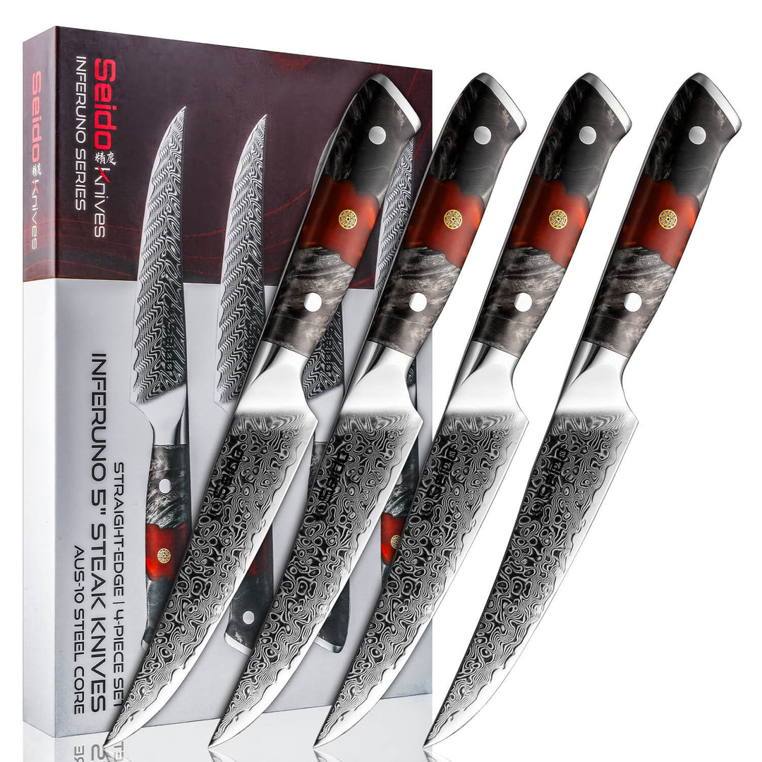 4-piece Inferuno steak knives with Damascus steel blades and red and black resin-wooden handles, displayed alongside their packaging.