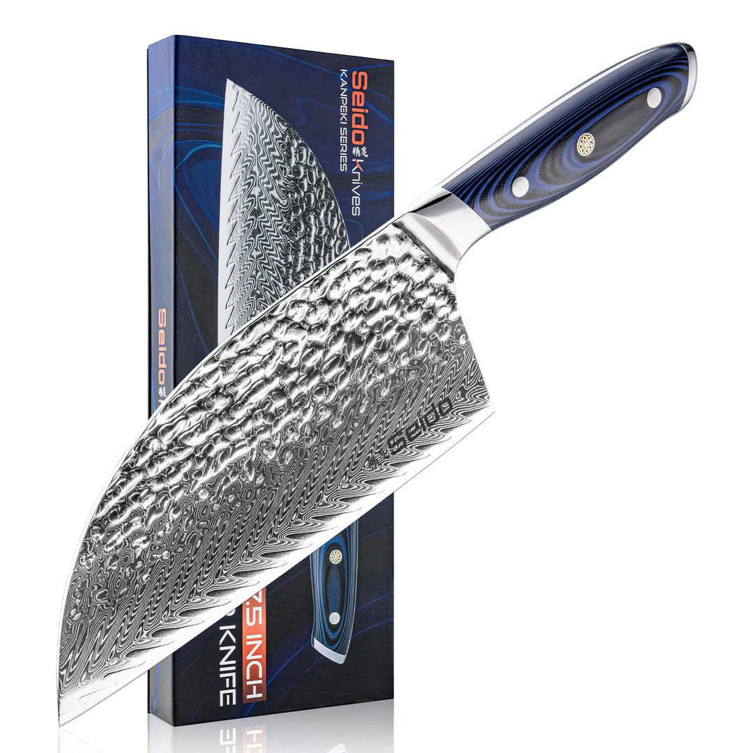 Kanpeki Cleaver Knife with a blue and black handle, and damascus blade next to its packaging on a white background