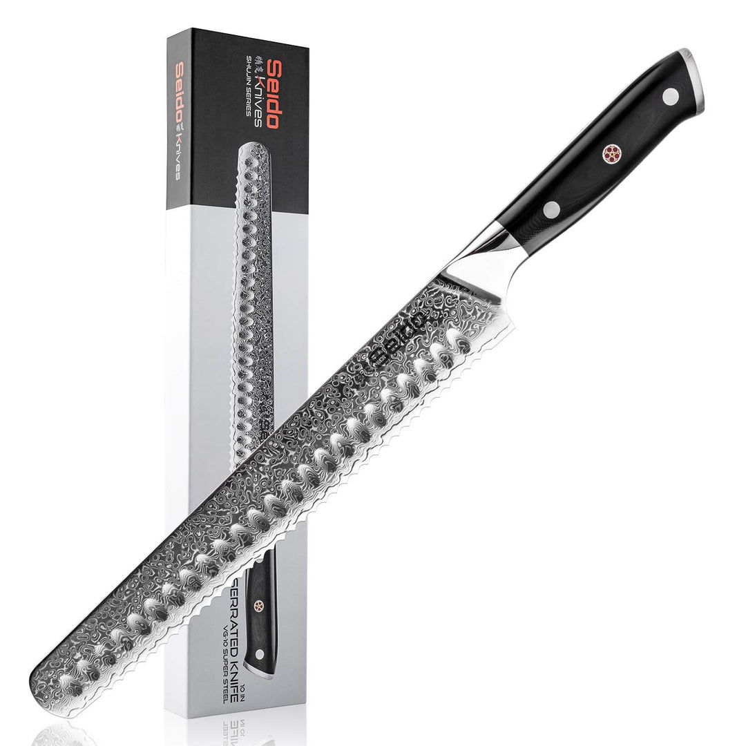 Serrated knife with black handle and Seido branding next to its packaging on a white background