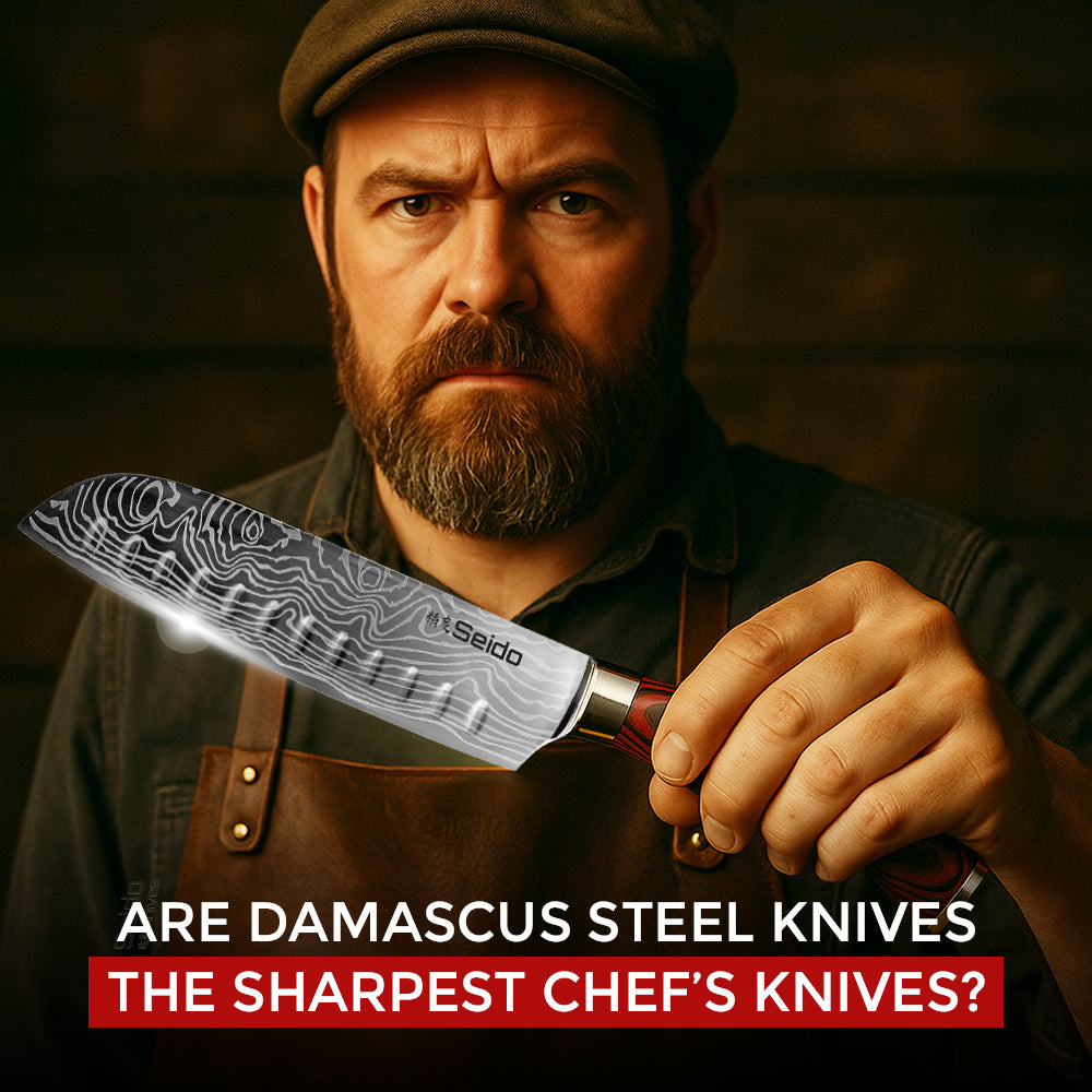 A man in a leather apron and flat cap holds up a Seido knife with a Damascus steel pattern.