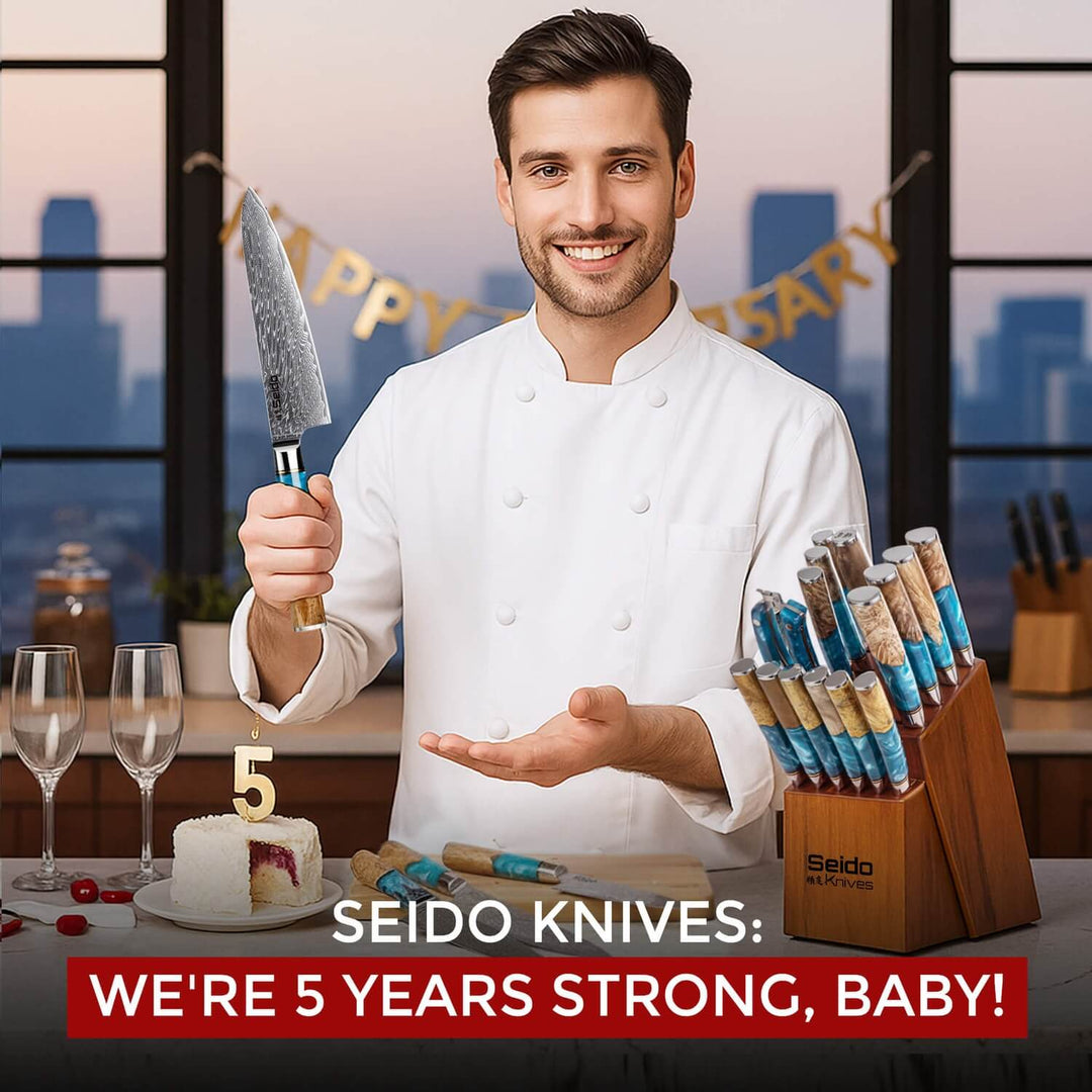 A chef celebrates the 5th anniversary of Seido Knives with a knife block and a cake with a number 5 candle.
