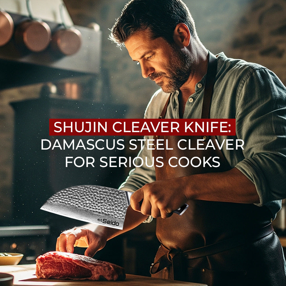 A chef in a leather apron holds a large, hammered-finish Seido Shujin cleaver knife over a raw steak in a rustic kitchen.