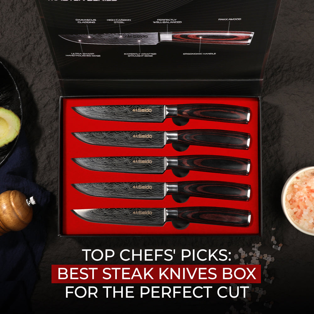 An open box of five Seido Damascus steel steak knives, styled with a salt bowl and avocado.