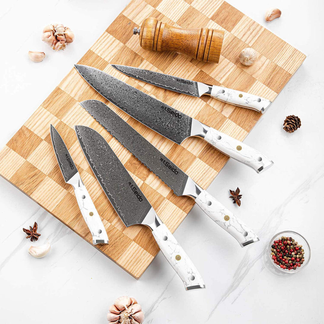 Takoizu series Knives displayed on a cutting board with ingredients