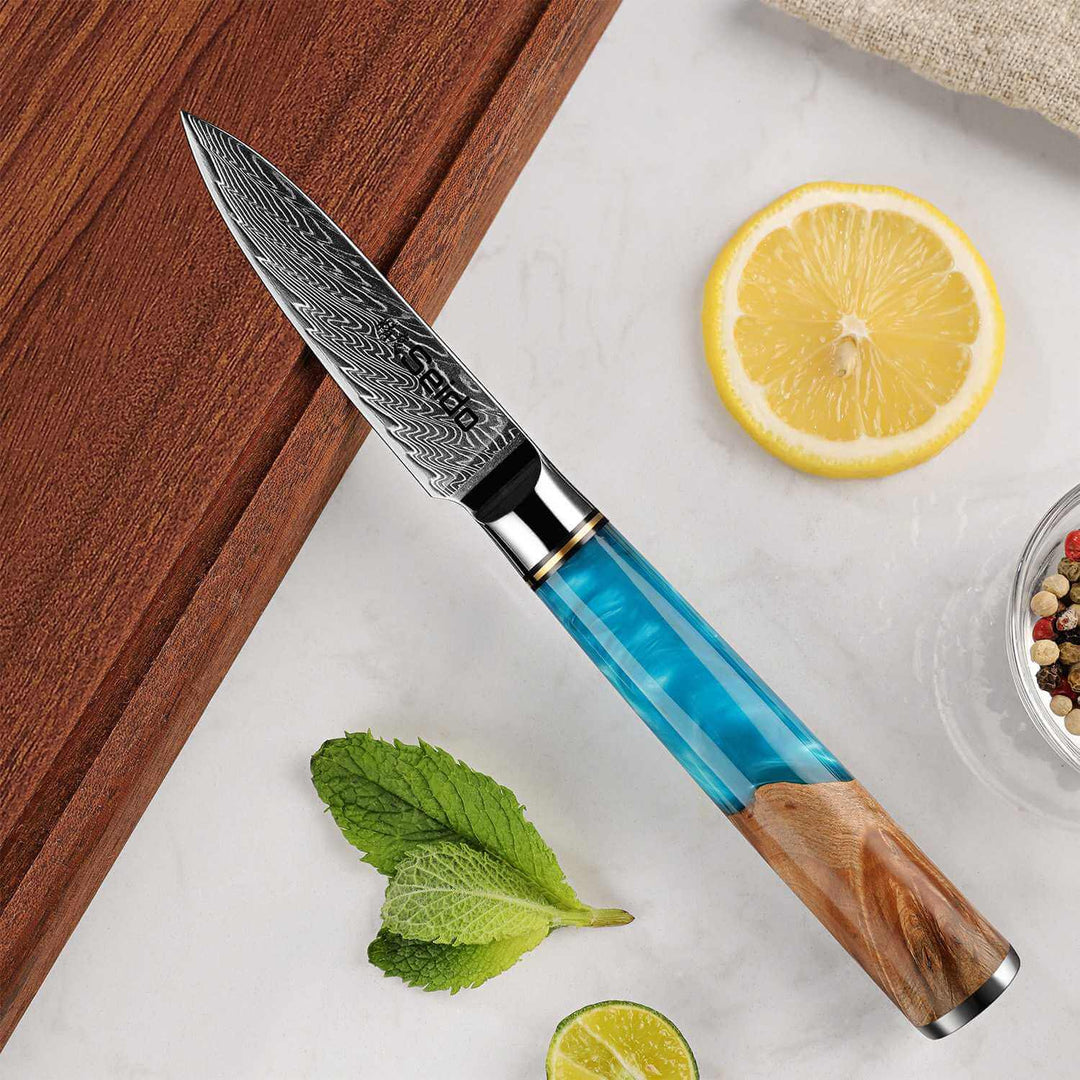 Executive Series 3.5" Paring Knife on a cutting board with ingredients