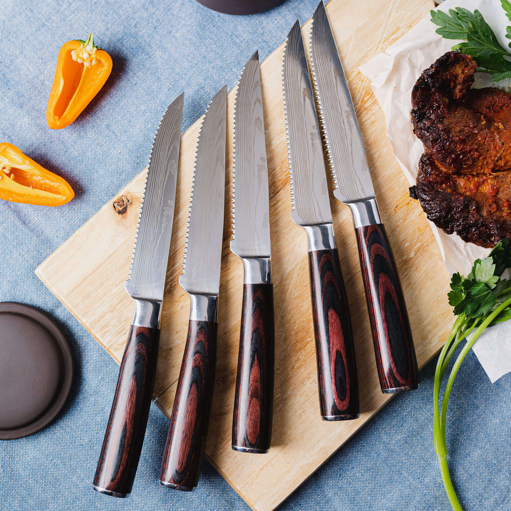 5-Piece Seido Steak knives on a table with meat