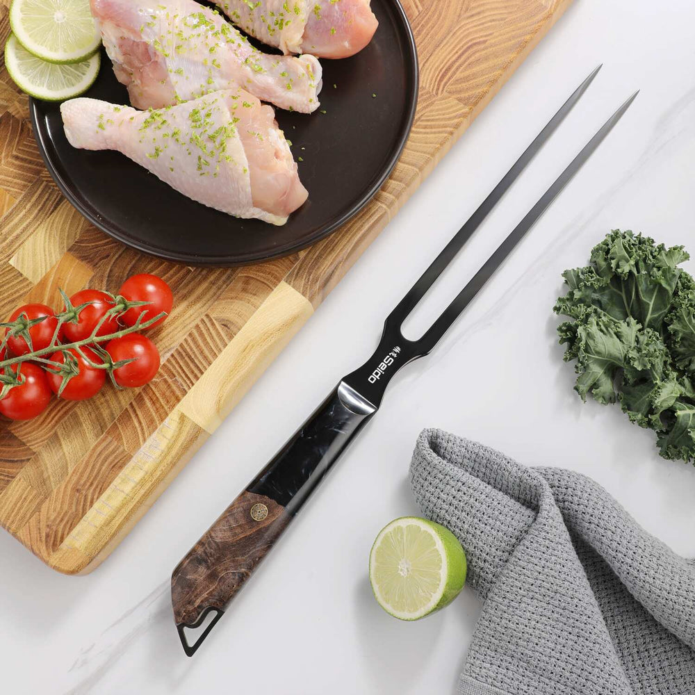 Titan Meat Carving Fork beside poultry and fresh ingredients