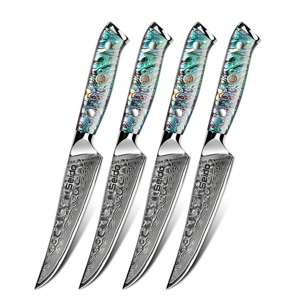 Four vibrant knives with mesmerizing green and blue patterned handles - Awabi non-serrated steak knives from Seido Knives.