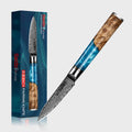 Decorative executive knife with wooden handle and blue blade next to its packaging on a light gray background