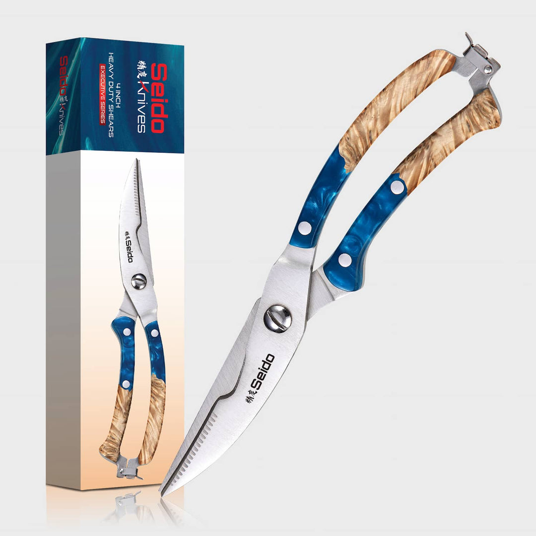 Kitchen shears with wooden handles and a branded box on a light gray background