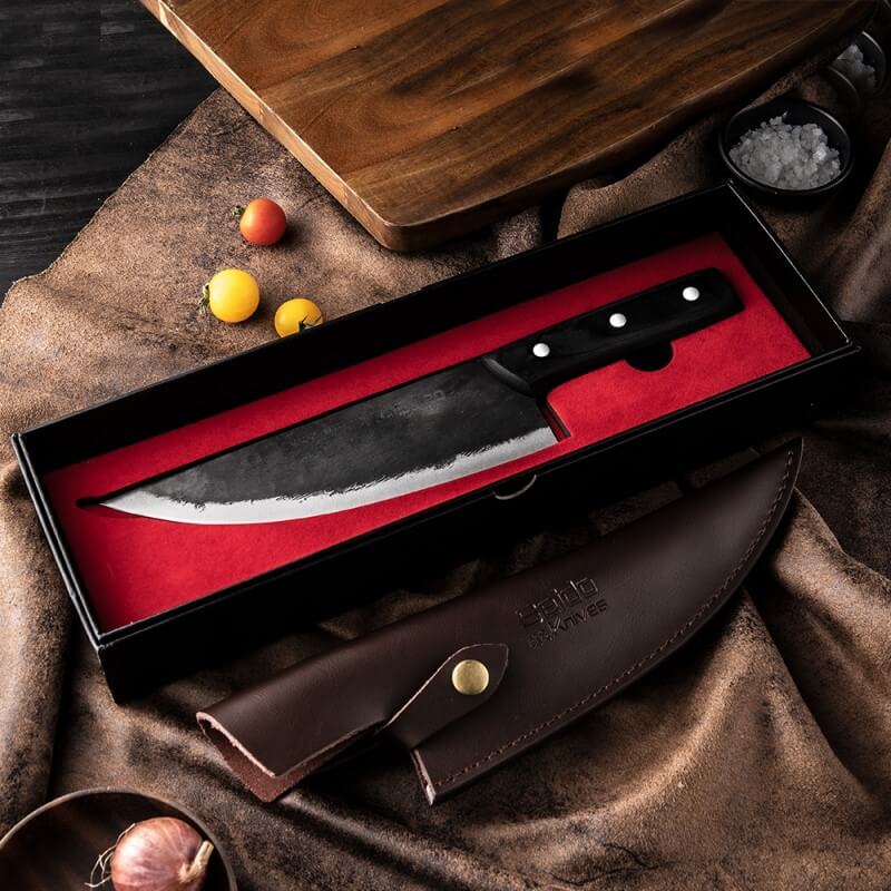 Introducing the Gyakusatsu Butcher's Chef Knife by Seido Knives - a sleek black-handled knife in a stylish black box.