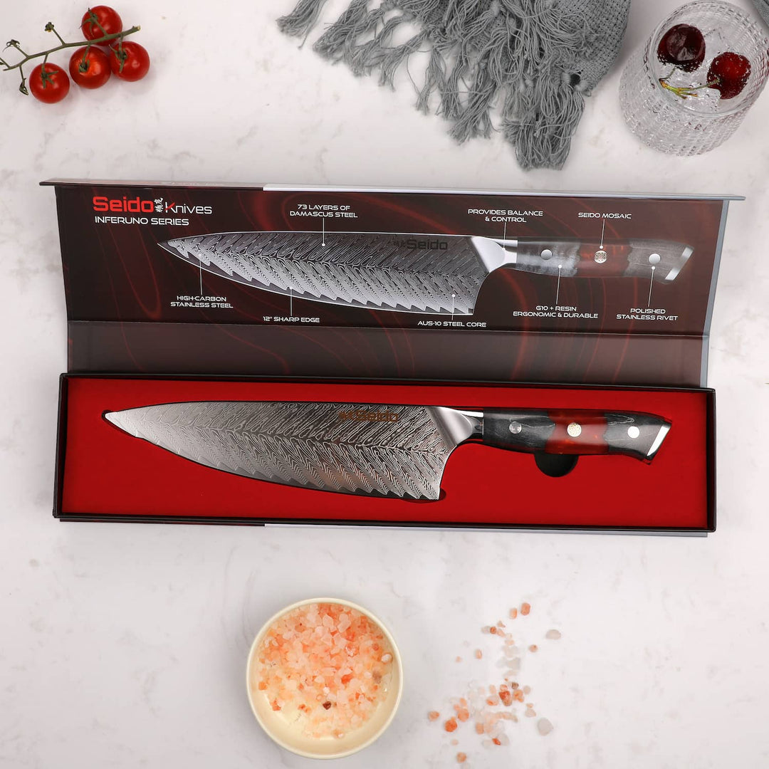 Discover the Inferuno Gyuto AUS10 Chef Knife from Seido Knives, showcased alongside a gift box on a table.