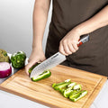Inferuno Santoku slicing vegetables on board