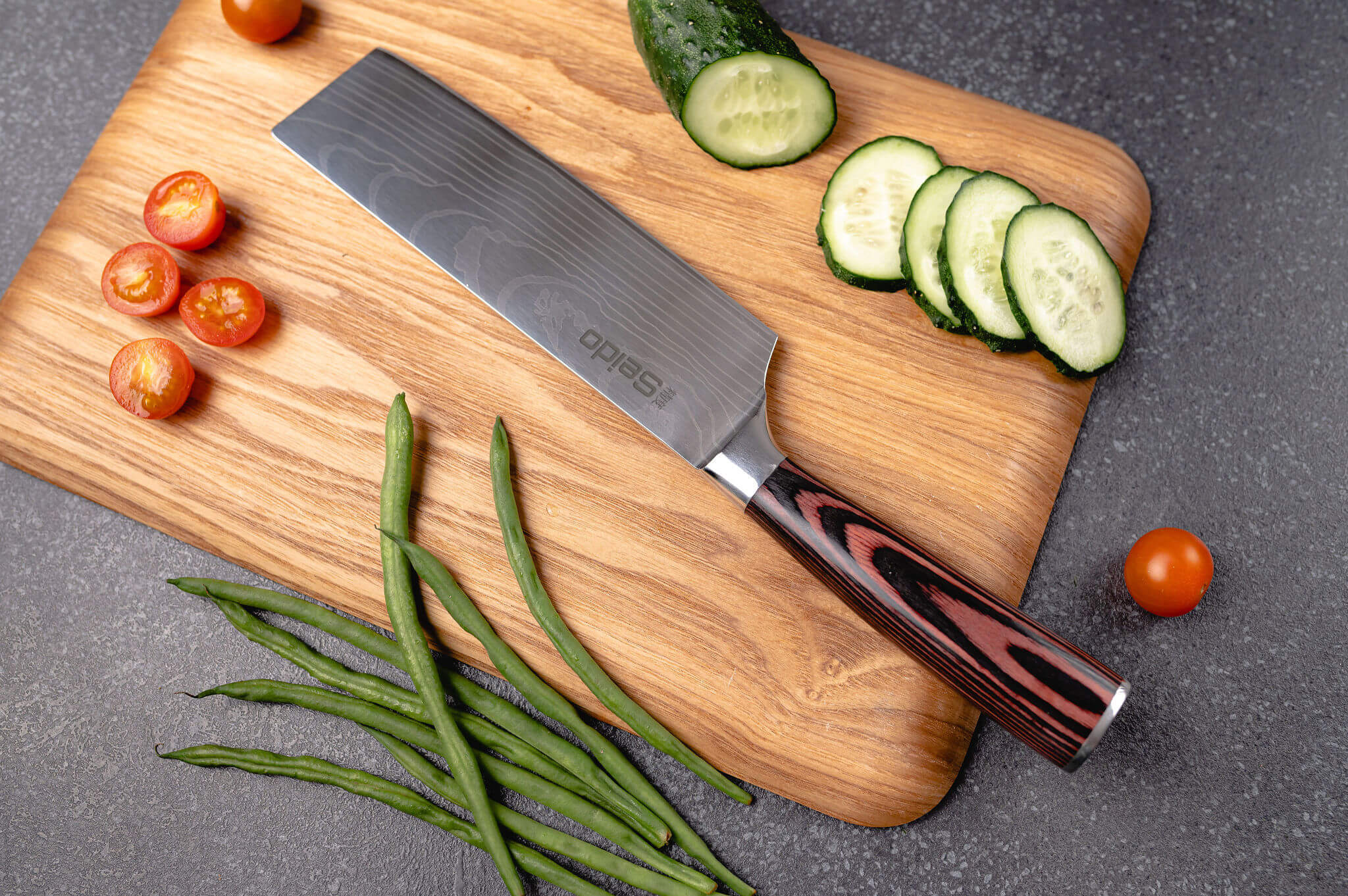 A knife on a cutting board with vegetables - a culinary scene of food preparation.