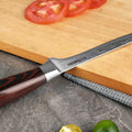 Knife with wooden handle on a cutting board with sliced tomatoes and a green pepper.