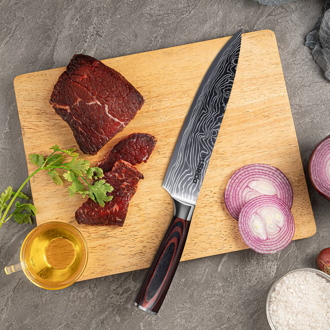 Seido's 8 inch master chef knife laying alongside meat and veggies