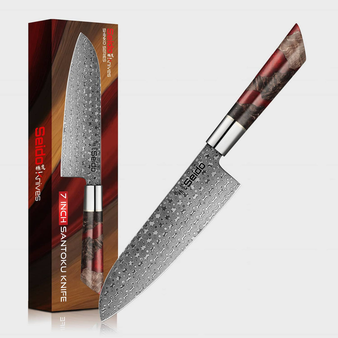 Shinko series Santoku knife with wooden handle next to its packaging on a white background