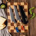Kiritsuke knives on cutting board next two saya knife cover