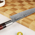 Shinko Series 7 inch Santoku on a cutting board.