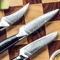 Shujin Damascus paring blades showing straight, serrated and bird’s beak profiles on a wodden cutting board.