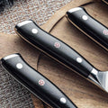 Close-up of Shujin G10 handle with polished rivets and mosaic pin for secure grip.