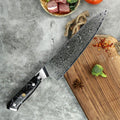 The Takoizu Gyuto Chef Knife from Seido Knives boasts a marbled black handle. This versatile blade is a kitchen essential!