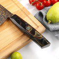 Close-up of the Kurogane Bunka G10 and mesh resin handle with decorative mosaic accent