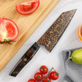 Overhead kitchen prep scene featuring the Kurogane Bunka knife with tomatoes and citrus