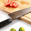 Close-up of the Kurogane Bunka 37-layer rainbow Damascus blade with copper brass and stainless steel pattern