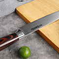 Close-up of the Master 8-inch slicing knife blade and Damascus-patterned finish