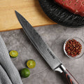 Master 8-inch slicing knife blade displayed in a kitchen setting with steak and citrus
