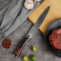 Master Series 8-inch slicing knife displayed beside steak and fresh citrus