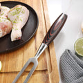 Master carving fork handle and polished stainless-steel neck detail