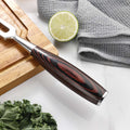 Close-up of the black and red pakkawood handle on the Master carving fork