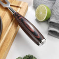 Detailed view of the contoured pakkawood handle and stainless end cap