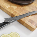Close-up of the Titan Boning Knife titanium-coated Damascus blade
