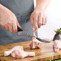 Titan 7-inch Boning Knife being used to trim poultry