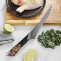 Titan Boning Knife styled with kale, citrus and poultry