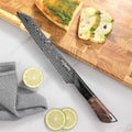 Close-up of the Titan Serrated Knife 67-layer Damascus cladding