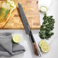 Titan 8-inch Serrated Knife displayed with artisan bread and fresh ingredients