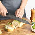 Titan Serrated Knife slicing a crusty loaf of bread