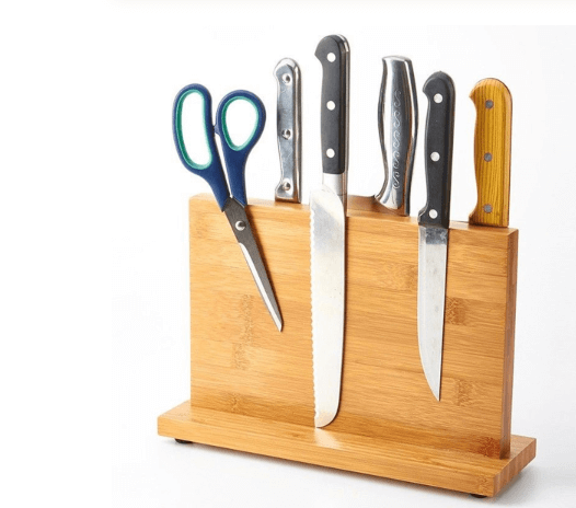 A magnetic knife block from Seido Knives, featuring four knives and scissors neatly arranged.