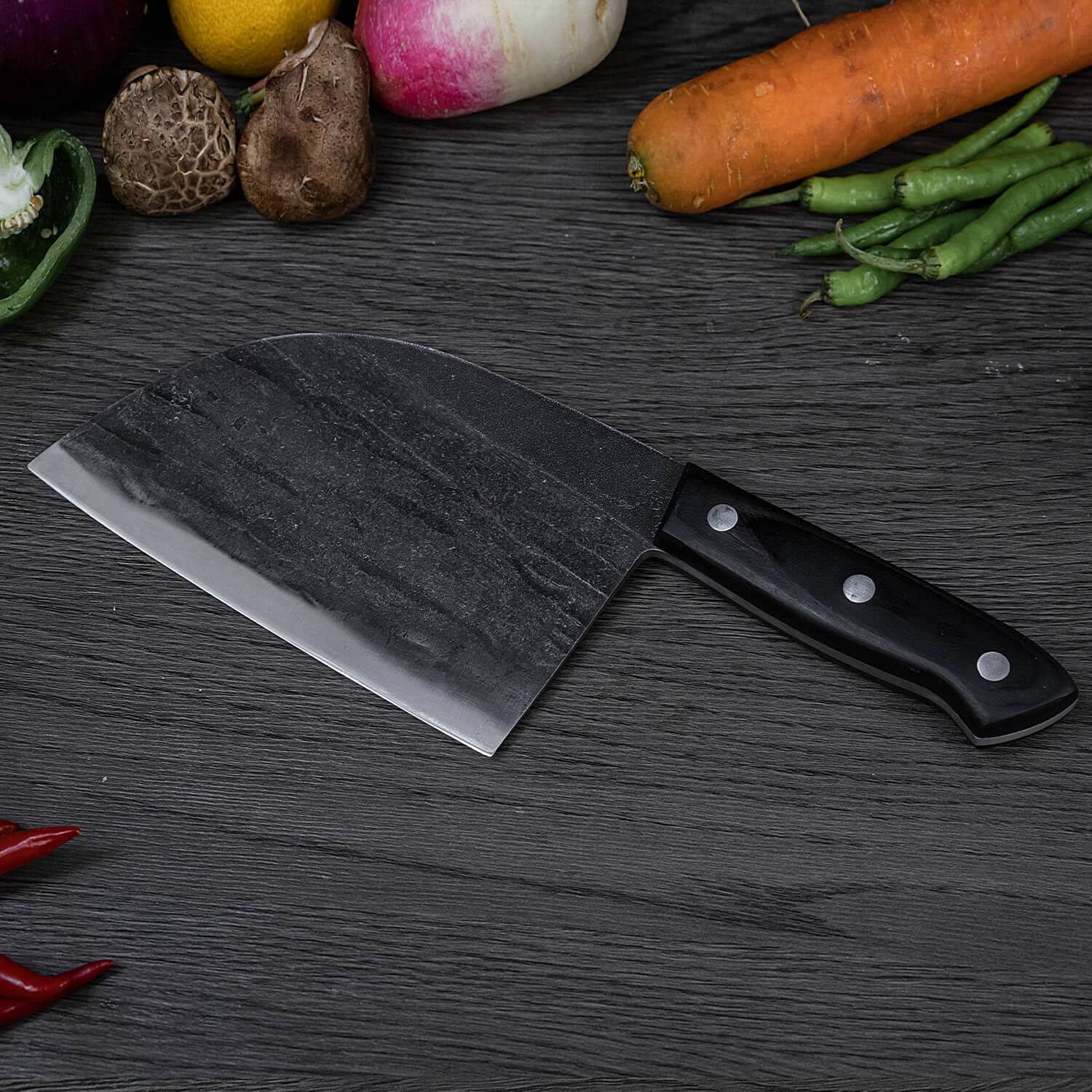 Behold the Seido Knives' Serbian Cleaver Knife, elegantly placed on a table alongside a medley of fresh vegetables.