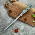 Behold the stunning Awabi Sharpening Steel Rod by Seido Knives, featuring a honing rod with blue and green handles.