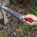 Chef holding red handle, Executive Damascus Steel Gyuto knife