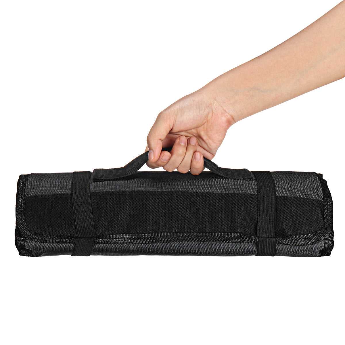 A person holding a black and gray roll up case, the knife roll bag from Seido Knives. Perfect for chefs on the go!